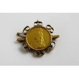 Victorian 1890 sovereign set in a 9 ct gold brooch mount. 12.