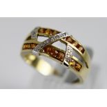 9 ct gold split band with yellow stones and diamonds