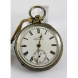 Hallmarked silver open face key wind pocket watch with roman numerals and gold fingers with key.