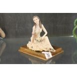 Balceri model in wood base seated lady