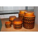 Four Hornsea pottery storage jars and a sugar bowl