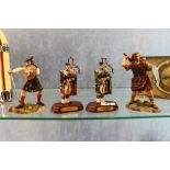 Four figurines of Scottish figures