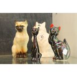 Persian cat by Beswick and three further examples