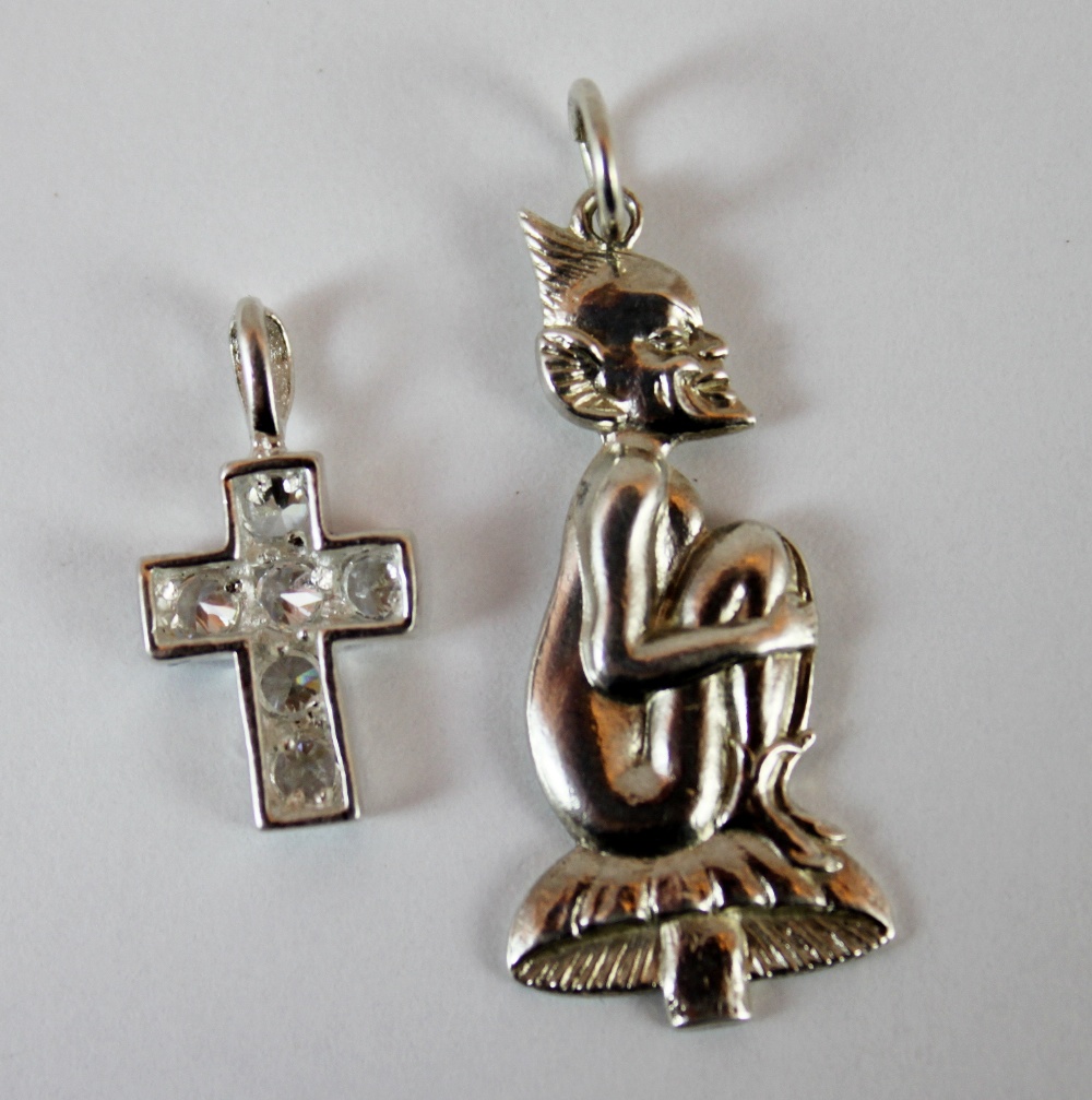 Silver goblin charm and a silver CZ cross