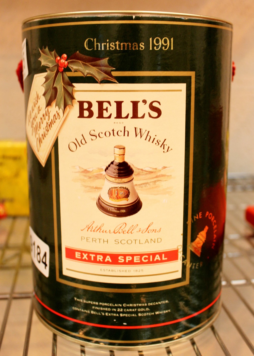 Boxed 1991 commemorative Bells whisky decanter sealed with contents