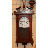 C Wood & Son wall hanging wood cased 31 day clock with key and pendulum