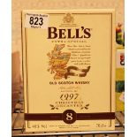 Boxed 1997 commemorative Bells whisky decanter sealed with contents