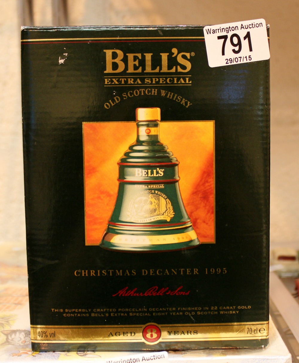 Boxed 1995 commemorative Bells whisky decanter sealed with contents