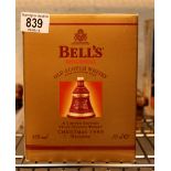 Boxed 1999 commemorative Bells whisky decanter sealed with contents