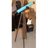 Vintage telescope with adjustable wooden tripod