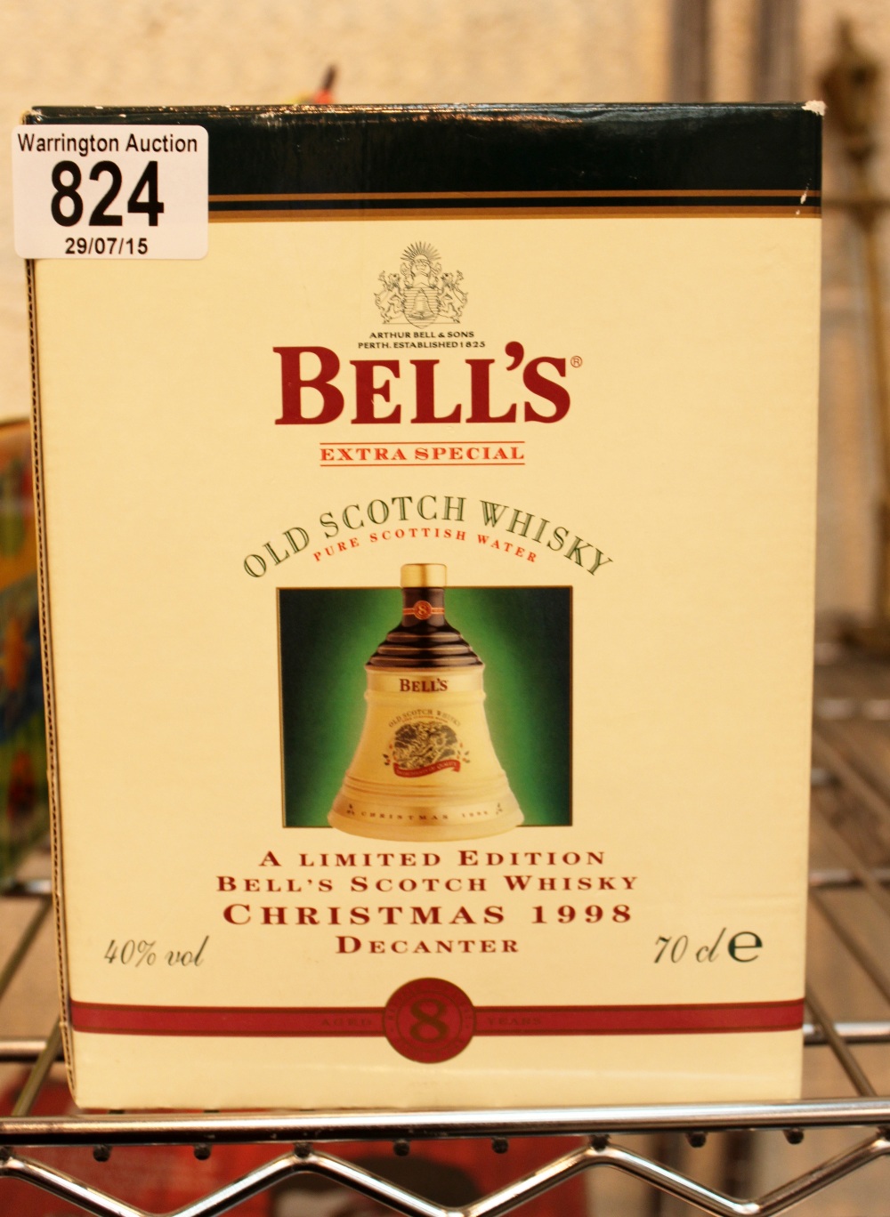 Boxed 1998 commemorative Bells whisky decanter sealed with contents