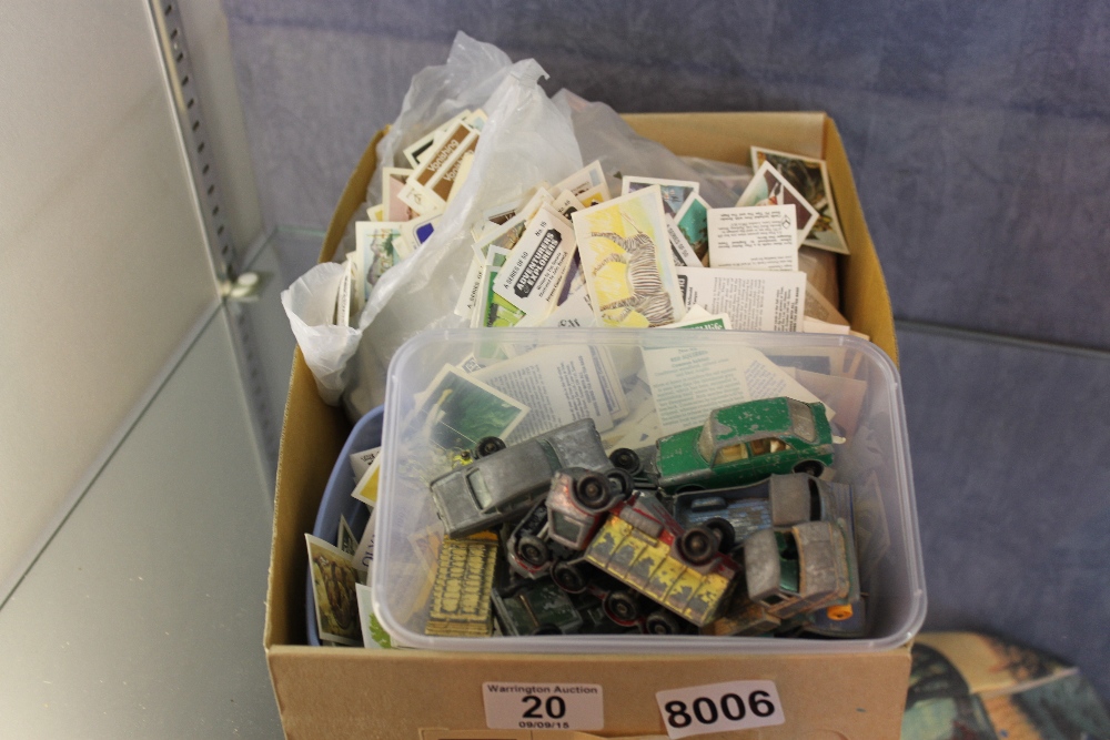 Playworn model cars and a box of loose cigarette and tea cards