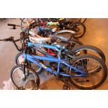 Four childrens bicycles,
