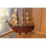 Treen figure of a sailing ship marked HMS Victory