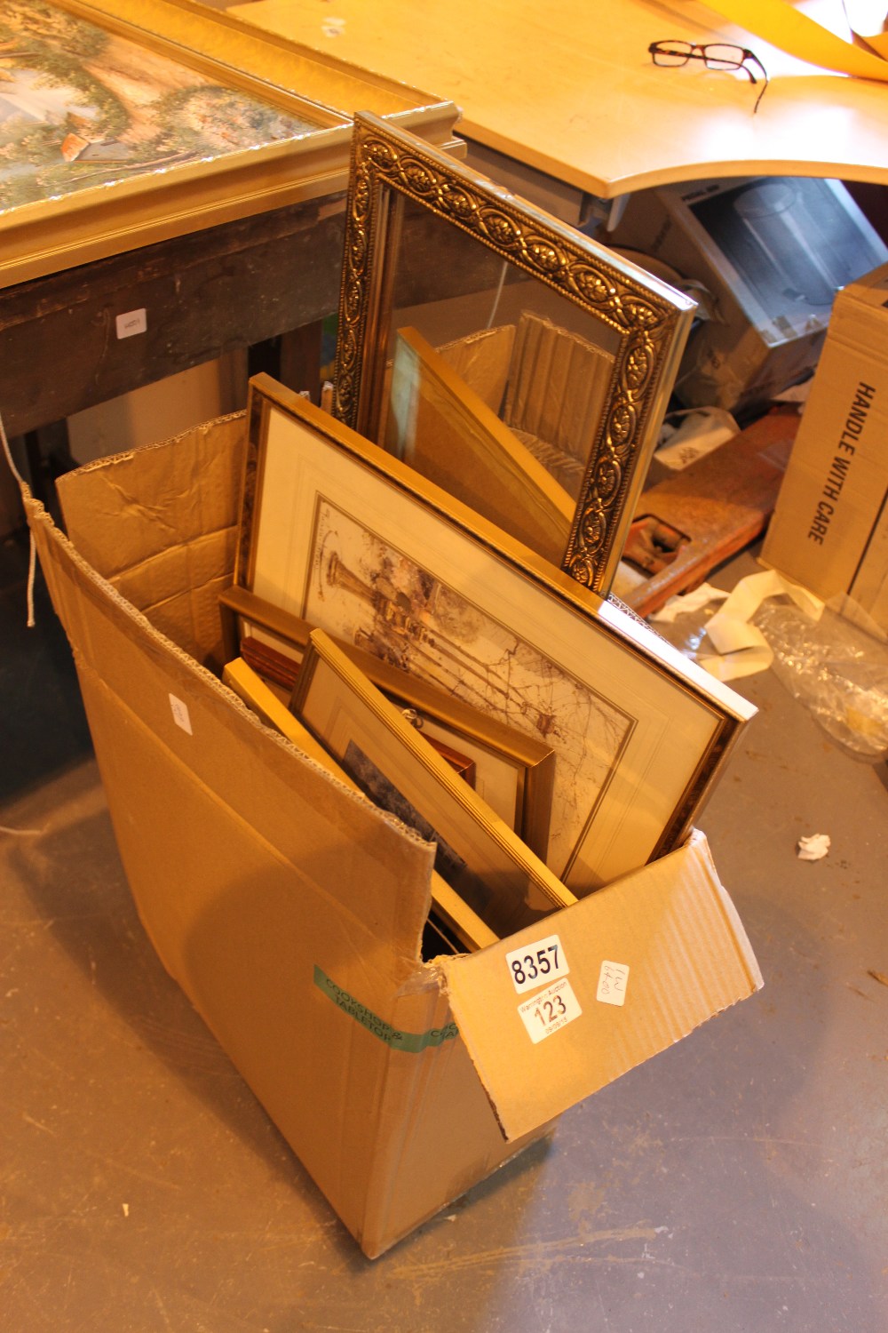 Box of mixed gold frame prints