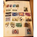 Two postage stamp albums with worldwide stamp contents and a quantity of loose stamps