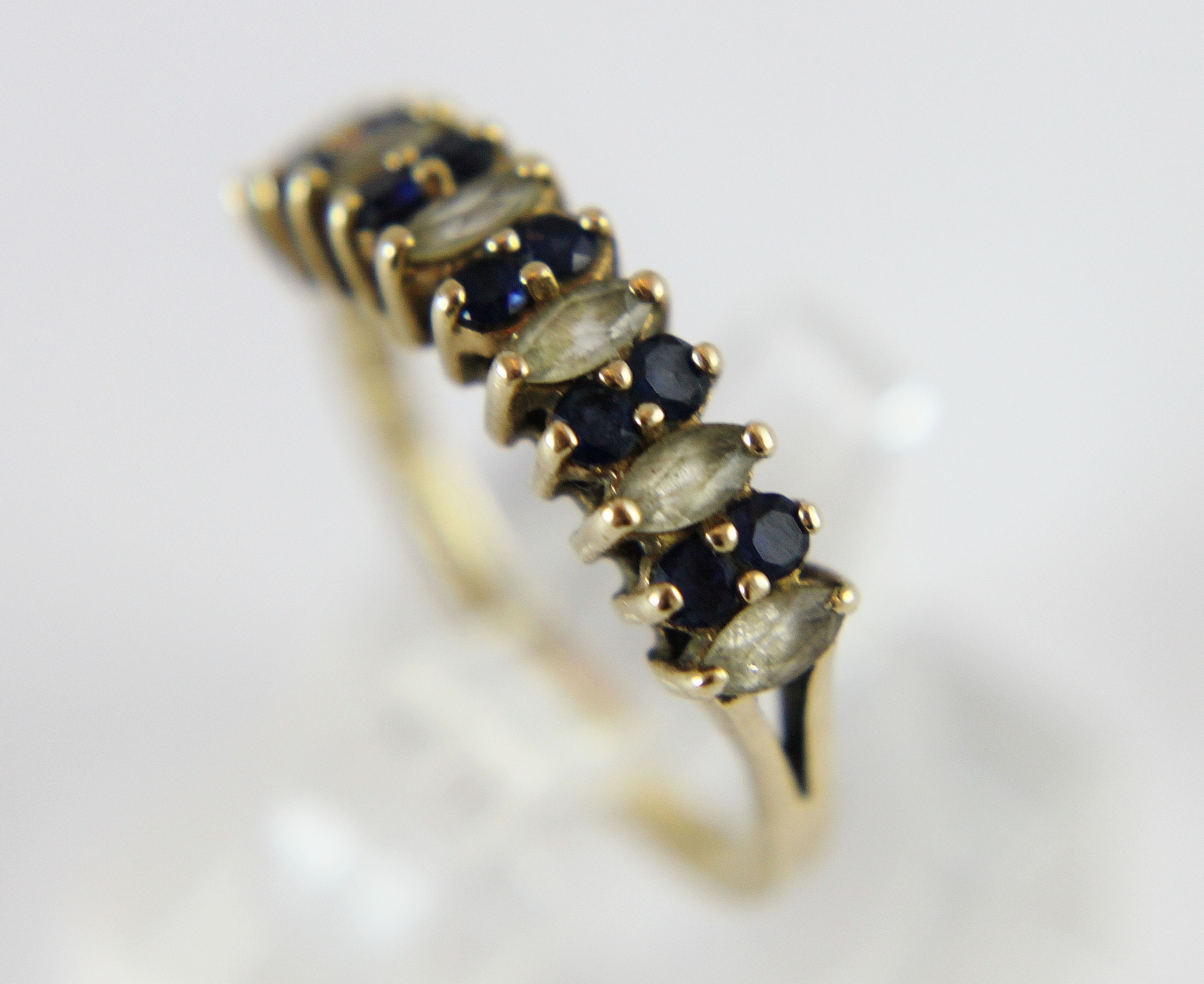 9 ct gold blue sapphire & white stone ring. Size N.