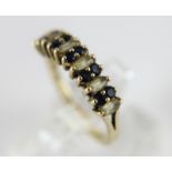 9 ct gold blue sapphire & white stone ring. Size N.
