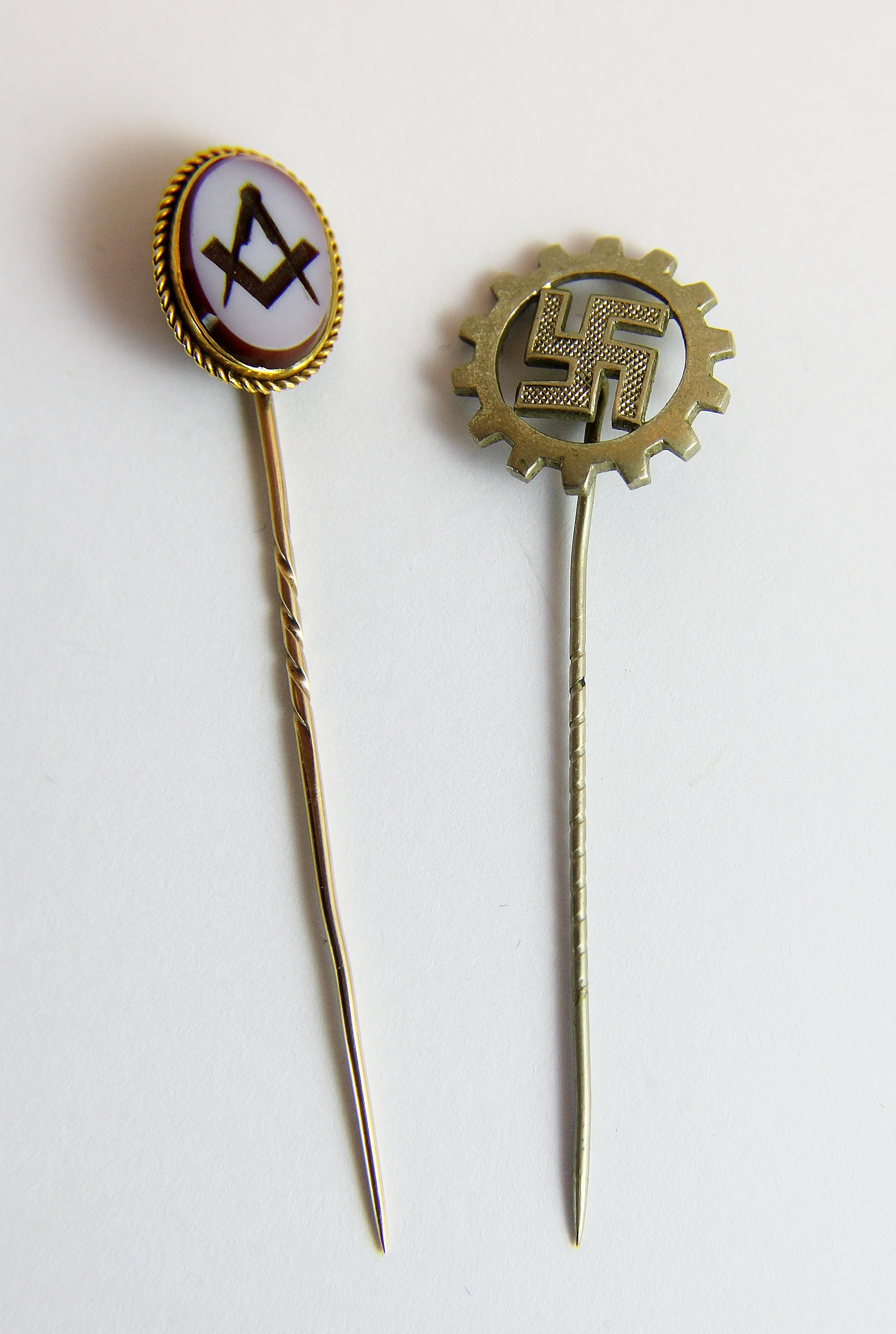 Masonic gold stick pin and a Swastika example