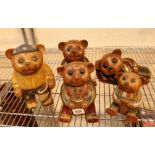 Five carved wooden hand painted bears