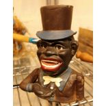 Cast iron black man money box with top hat