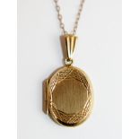 9 ct gold locket and two chains.