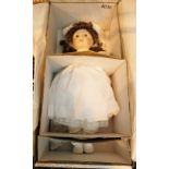 Franklin heirloom doll with porcelain head and hands in original box.