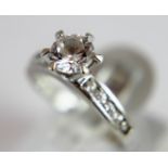 Sterling silver fancy solitaire ring with stone set shoulders size O