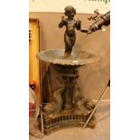 Fountain on heavy cast iron dolphin base featuring mannequin pis