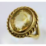 Heavy yellow metal topaz set ring. 5.9g. Size K/L.