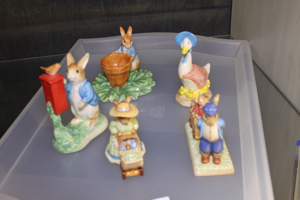 Four rabbit figurines and one duck including Royal Doulton,