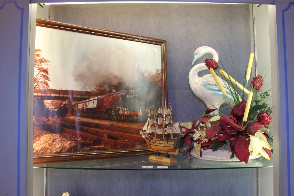 Shelf of mixed items including a model of HMS Victory