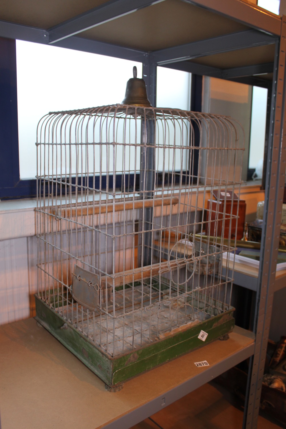Metal parrot cage on claw feet