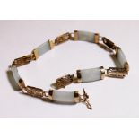 9 ct yellow gold and pale jade Oriental bracelet