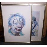 Two framed clown prints signed M Bulli.