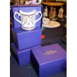 Four boxed Royal Worcester mugs