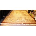 Large brown ground wool pile rug.