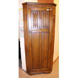 Oak corner wardrobe with carved decoration