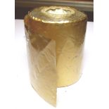 Roll of gold metallic material on a plastic backing. Tested by us as inconclusive. Total weight