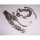 Three silver bracelets,