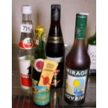 Four bottles of mixed spirits including Ouzo and Mirage,