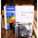 Boxed Olympus Stylus SZ-16 with charger and papers