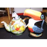 Reproduction Guinness toucan jug and a Winnie the Pooh teapot