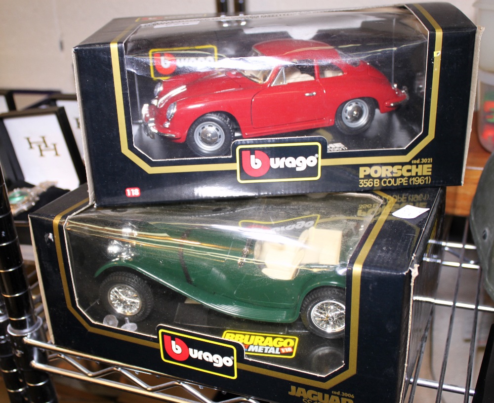 Three Burago 1/18 model cars, Bugatti, Jaguar and Porsche,
