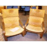 Two leather sprung armchairs