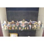 Shelf of mixed ornaments and collector's plates