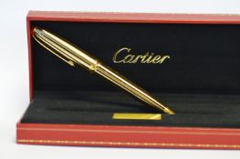 An attractively boxed ballpoint pen with reeded black enamel and spare refills compete with original