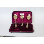 An attractive boxed pair of berry spoons with gilded bowls and matching sifter spoon. Sheffield