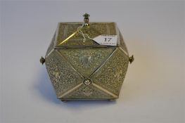 A good Indian multi faceted tea caddy, heavily embossed with figures and scrolls with lift off cover