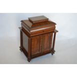 An attractive mahogany lady's stationery box with four fitted drawers with panelled doors, reeded